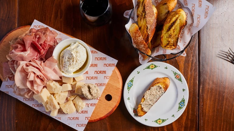 Meat and cheese board with Prosciutto di Parma, mortadella, Robiolina,...