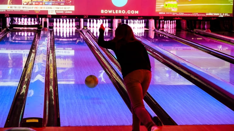 A bowler attemptps a strike at Bowlero on East Jericho...