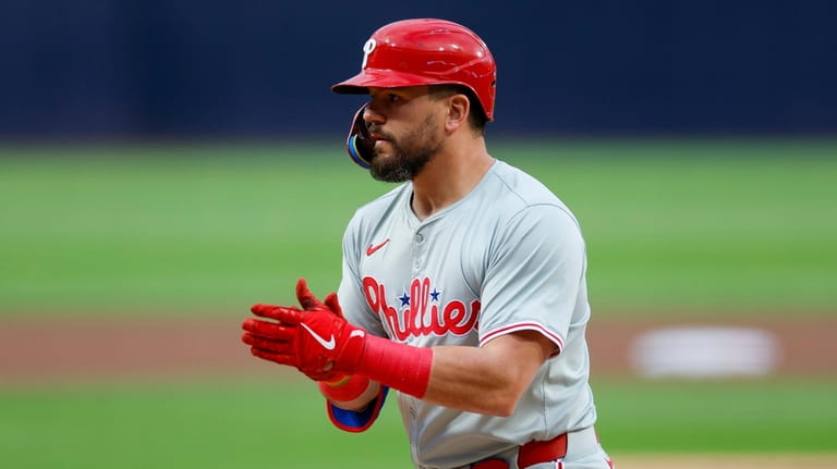 Philadelphia Phillies' Kyle Schwarber celebrates after his solo home run...