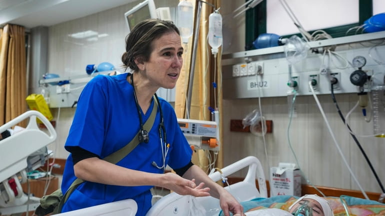 Pediatrician Tanya Haj-Hassan, examines wounded Gazan children at Al-Aqsa Martyrs...