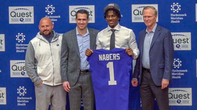 Malik Nabers with Giants management at Giants Training Center after...