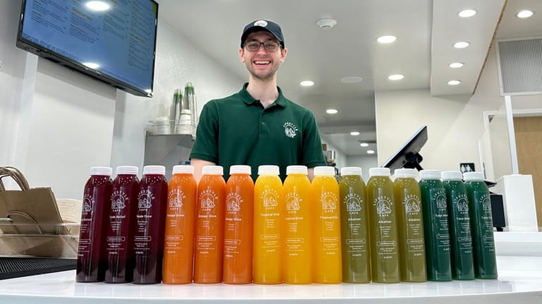 Owner Tom Ligouri with fresh-pressed juices at Lifestyle Cafe in Port...